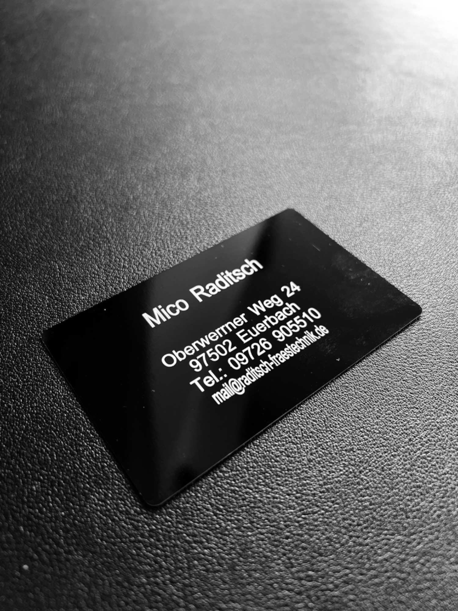Laser-engraved metal business card